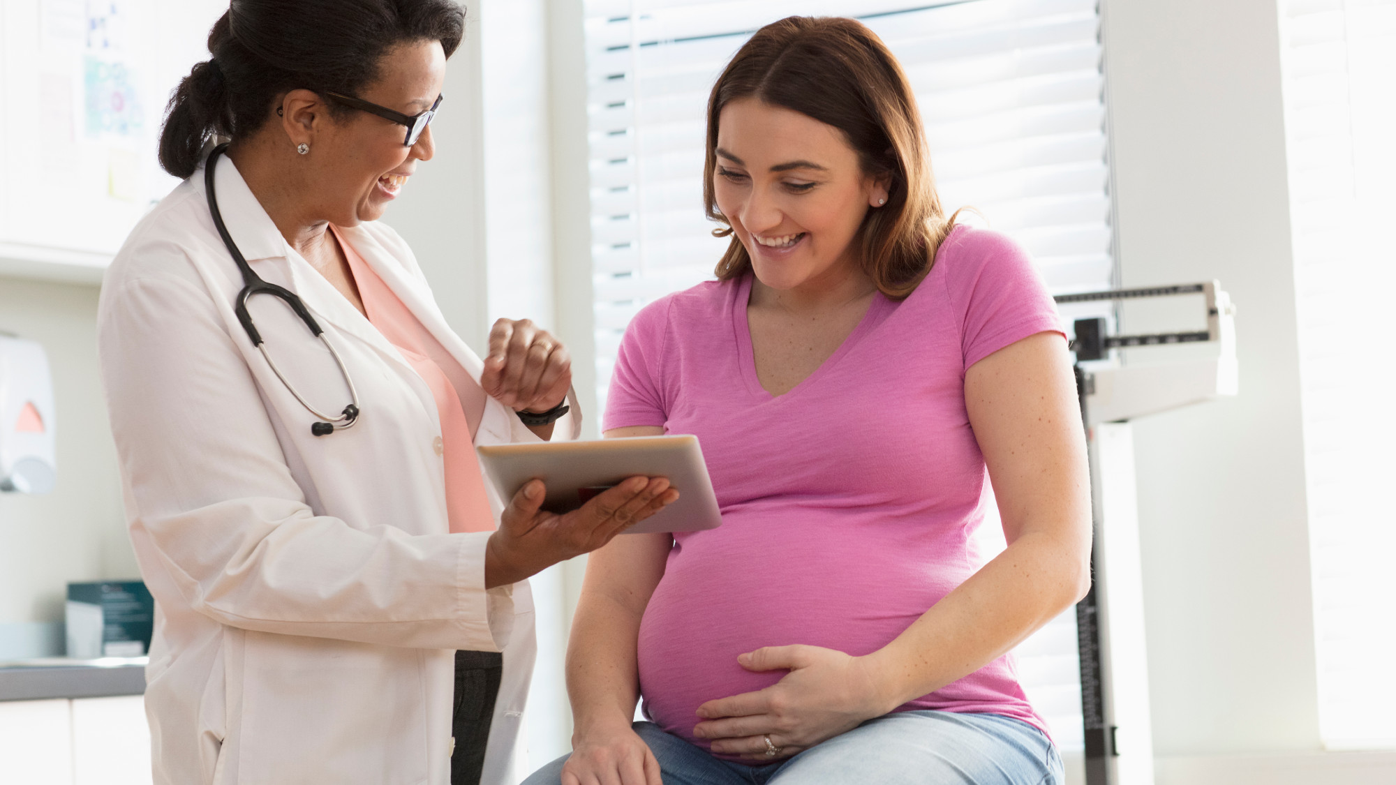 Pregnant woman getting checkup at doctor's office